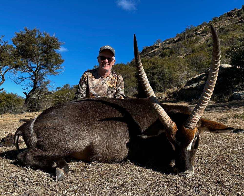 Hunter with great Waterbuck from Eastern Cape in South Africa